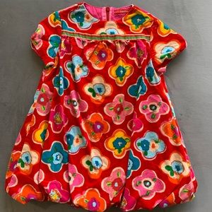 Oilily Corduroy bubble dress with bright floral pattern.